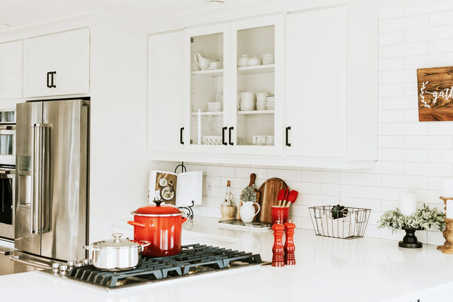 Person cleaning a polished natural stone countertop with a soft cloth and mild soap.